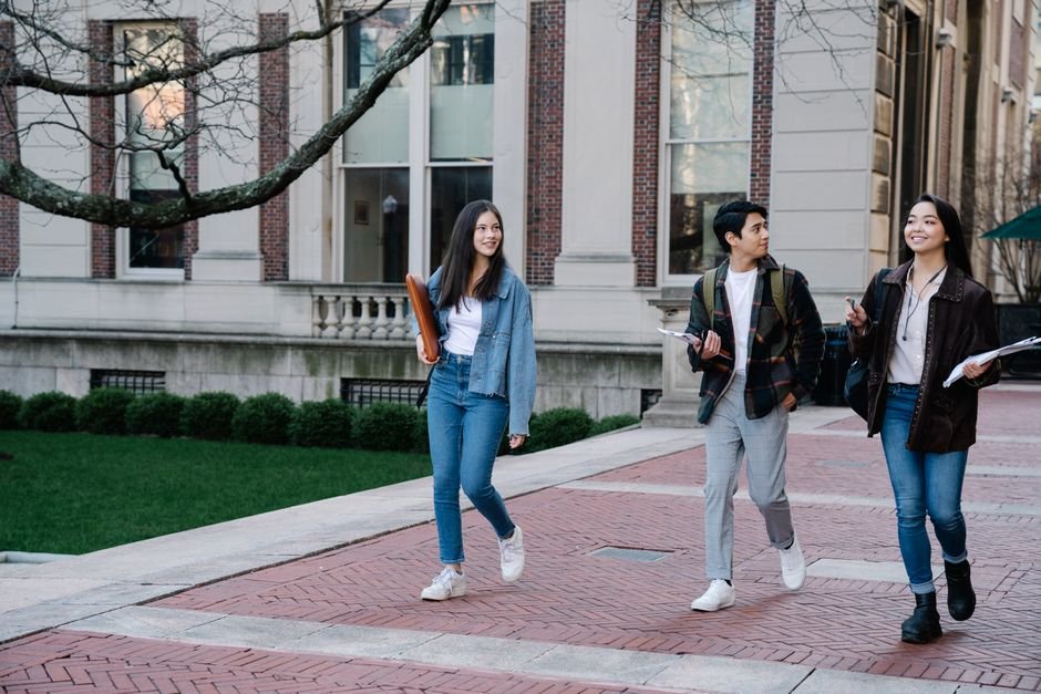 Group of international students walking together on a UK university campus